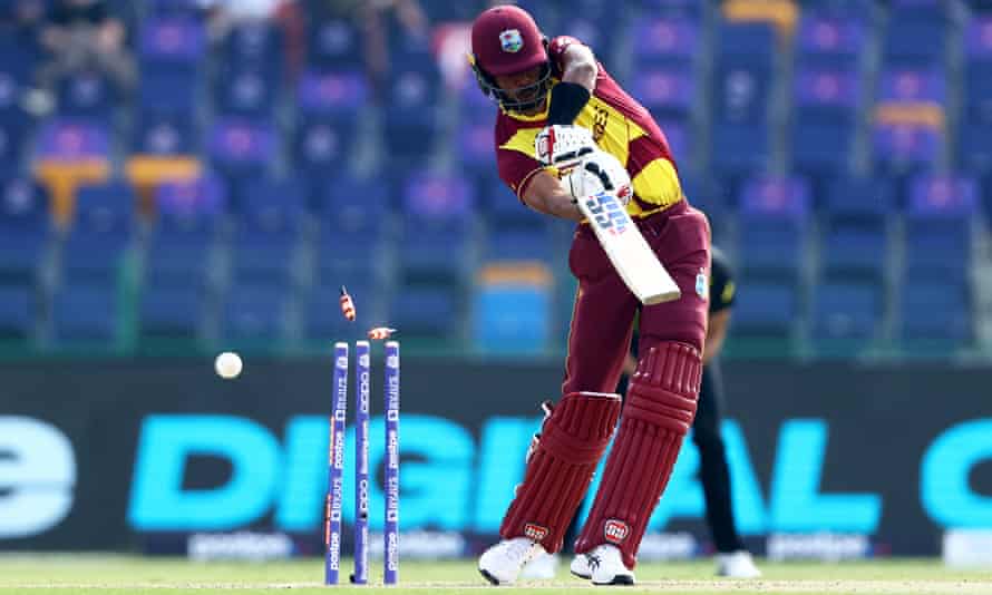 Roston Chase is bowled by Josh Hazlewood