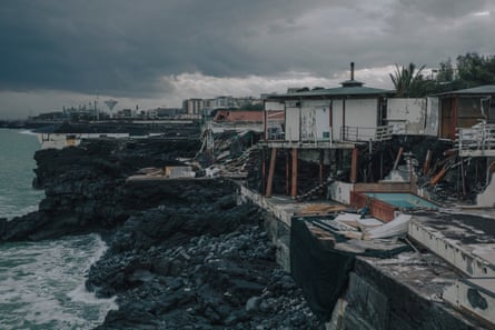 Drone view of wrecked buildings beside the Mediterranean
