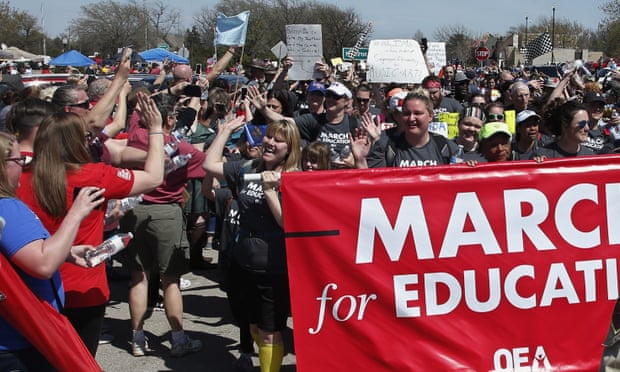 Marchers are greeted at the state Capitol after marching 110 miles from Tulsa as protests continue over school funding, in Oklahoma City, on 10 April.