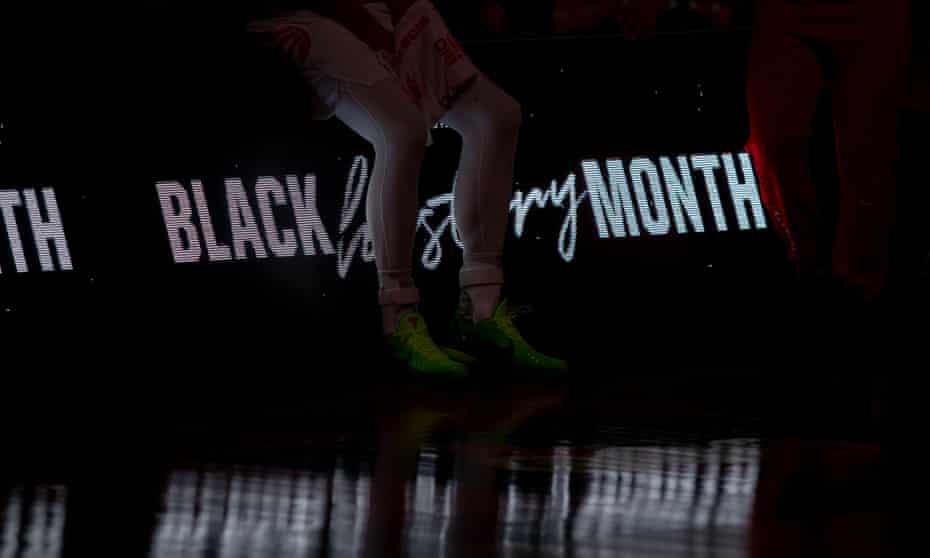 NBA: Minnesota Timberwolves at Toronto Raptors<br>Feb 14, 2021; Tampa, Florida, USA; Members of the Toronto Raptors sit on a sign honoring Black History Month before a game between the Toronto Raptors and the Minnesota Timberwolves at Amalie Arena. Mandatory Credit: Mary Holt-USA TODAY Sports