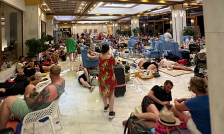 People sitting and lying in a hotel foyer