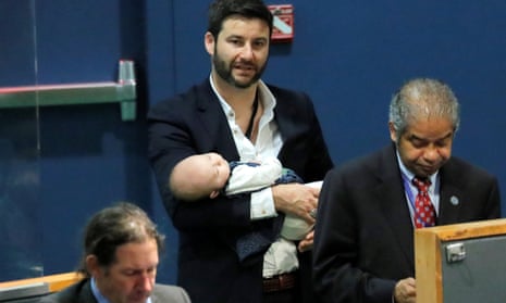 Clarke Gayford, partner of New Zealand’s prime minister Jacinda Ardern, holds baby Neve at a meeting at the UN in New York