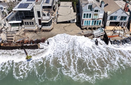 Water rushes through broken seawall defences at Dana Point, California.