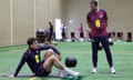 Gareth Southgate oversees Harry Maguire, who stretches on a mat.