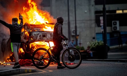 A police car set on fire during a riot in Sunderland