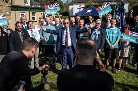 Farage posing for photos at the Bird in Hand pub in Bromley, 8 April.