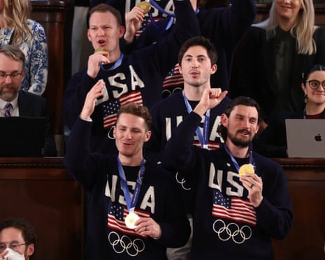 Members of the S. Olympic men’s hockey team that won the gold medal cheer during the state of the union address.