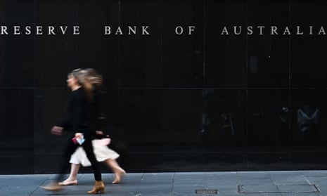 People walk past the Reserve Bank of Australia in Sydney