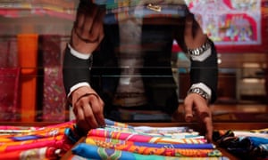 Hermès, which is famous for its silk scarves, above, and leather bags, says sales in Asia excluding Japan grew by 7% in the first six months of 2015.