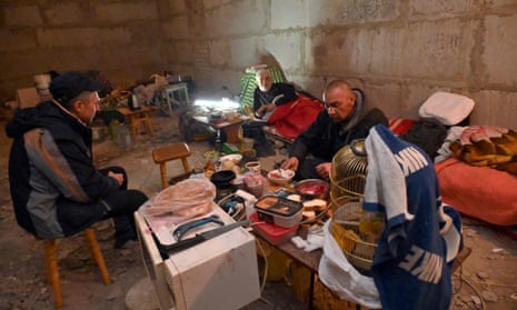 Inhabitants shelter from Russian shelling in the basement of a multi-storey building.