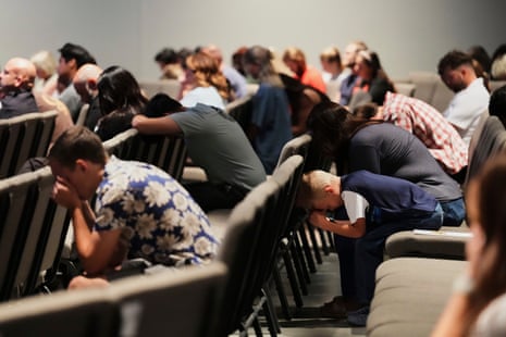 Congregants bow their heads during a prayer event at CenterPoint Church, the day after Charlie Kirk was killed.