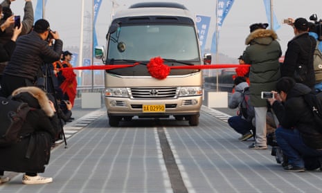 The first vehicle is driven on the photovoltaic road in Jinan, China. Only days after it was opened, thieves have stolen some of the technology.
