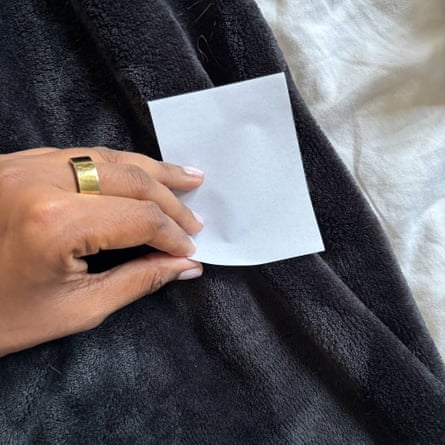 A LintZapper Portable Disposable Sheets removing cat hair