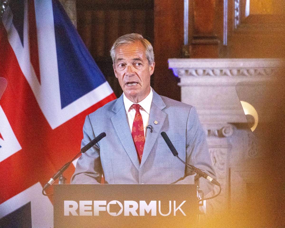 Farage stands at Reform UK podium in front of a union flag