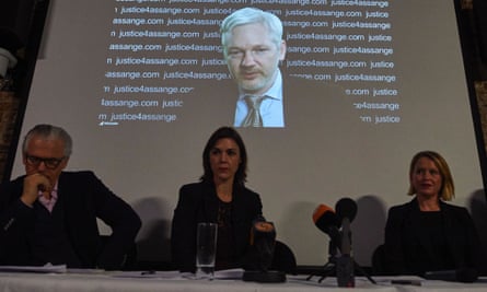 WikiLeaks founder Julian Assange is projected onto a screen behind Spanish jurist Baltasar Garzón and Australian lawyers Melinda Taylor and Jennifer Robinson.