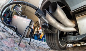 A measuring hose for emissions inspections in diesel engines sticking in the exhaust tube of a Volkswagen Golf 2.0 TDI.