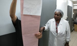 Sharon Nkansah looks at food safety paperwork at a branch of KFC