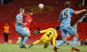 West Ham United’s Lukasz Fabianski in action with Manchester United’s Marcus Rashford.