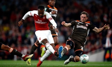 Arsenal’s Alexandre Lacazette hammers in the decisive third in their Carabao Cup tie against Brentford.