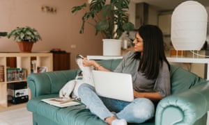 Psychological well being within the office: what can employers do to assist throughout Covid? | Getting again on monitor 2 Young woman working from home on her laptop near to her dog.