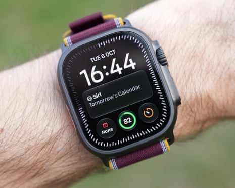 An Apple Watch Ultra 4 on a wrist displays the time, Siri suggestion, and fitness rings