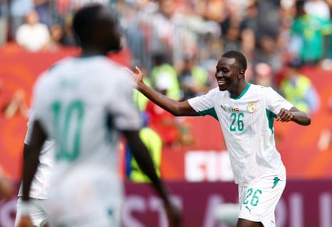 Senegal's Pape Gueye celebrates scoring their fourth goal.