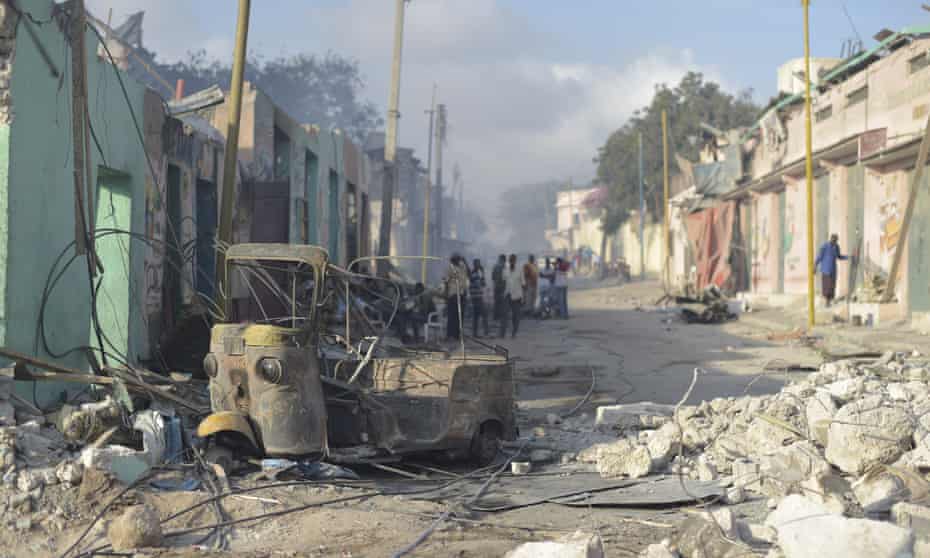 The wreckage of a vehicle lies among the rubble at the site of Saturday’s attack in Mogadishu, Somalia.