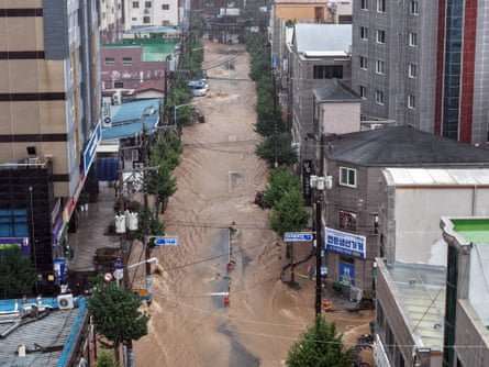 A road covered with flood waters after the torrential rain in Geoje, South Korea.