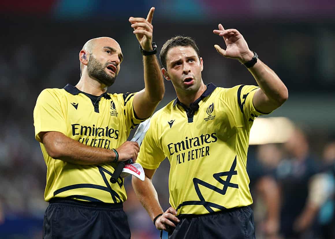 Referee Nika Amashukeli (right) reviews the try of England’s Courtney Lawes against Japan.