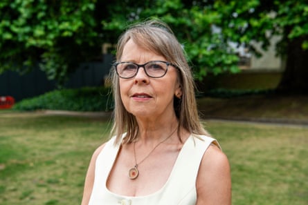 Julie Devey standing outside.