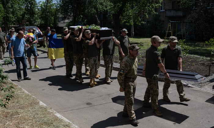 Ukrainian servicemen carry the coffin with the body of Ihor Slavhorodskyi, on June 11, 2022 in Bucha, Ukraine. Ukrainian soldier Ihor Slavhorodskyi, 58, died in Luhansk Region on June 2, 2022.