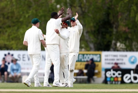 Jason Holder of Worcestershire celebrates with his teammates after taking the wicket of Lewis Gregory.
