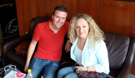 Justin on a brown sofa next to Nichola