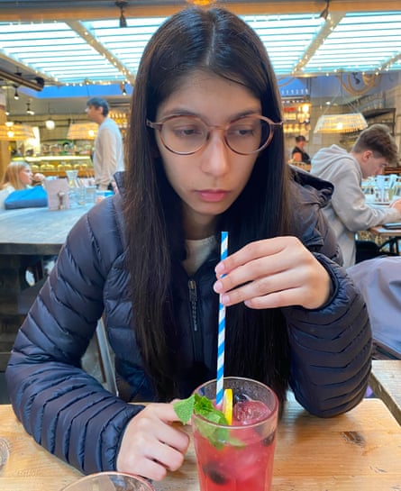 Naina Mishra in October 2024, drinking a pink drink from a straw