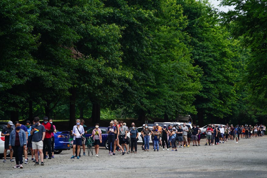 People wait in line to vote in Georgia’s Primary Election on June 9, 2020 in Atlanta, Georgia. Georgia, West Virginia, South Carolina, North Dakota, and Nevada are holding primaries amid the coronavirus pandemic.