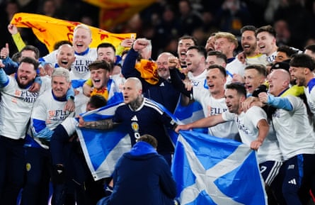 Scotland players and head Steve Clarke observe aft they qualified for nan 2026 World Cup aft beating Denmark 4-2