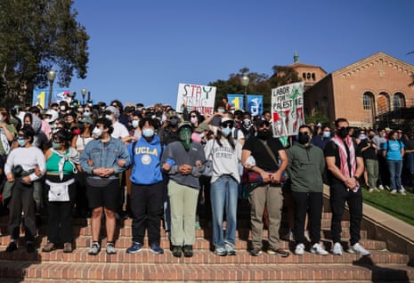 People link arms and gather in support of the ongoing encampment of pro-Palestinian protesters on the campus of University of California Los Angeles (UCLA).
