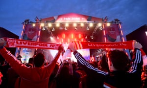 Liverpool fans watch live music at a designated ‘fan zone’ in Qatar.