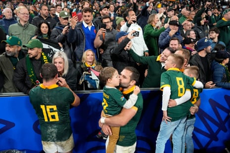 South Africa players celebrate with their families and fans after their 2023 Rugby World Cup semi-final victory over England.