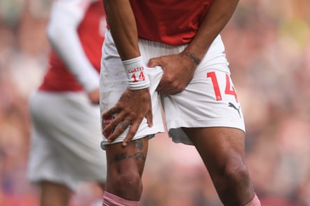 May 5: Pierre-Emerick Aubameyang of Arsenal holds his crotch after a collision against Brighton.