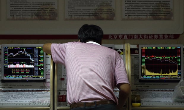 A man checks stock prices in Beijing