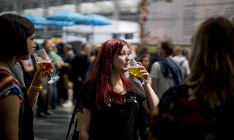 Ale enthusiasts sample drinks at the Great British Beer Festival in west London.