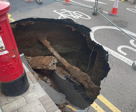 Sinkhole on a road in Eltham next to a postbox