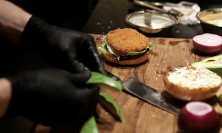 Preparing a burger.