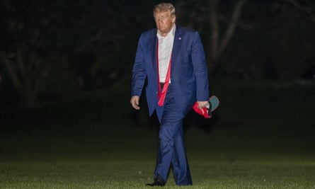 Donald Trump walks on the South Lawn of the White House after returning from the Tulsa rally.
