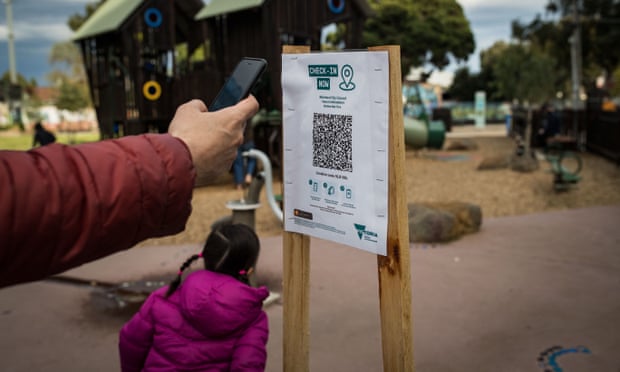 A parent uses the QR code check-in at a playground in Melbourne on 3 September.