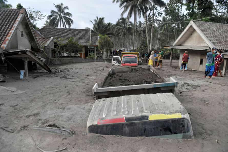Trucks covered by volcanic ash in Sumberwuluh.