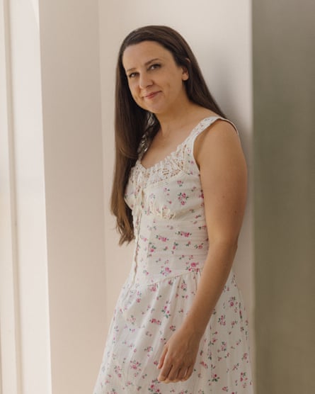 Ms Rachel in a white printed sleeveless dress with her hair down