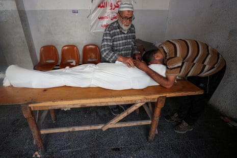 Mourners during the funeral of Palestinian people killed in an Israeli airstrike on a school at Al-Ahli Arab hospital in Gaza City.