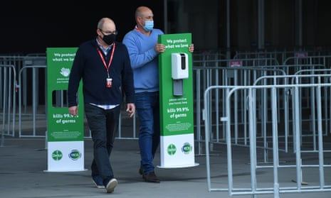 People set up a coronavirus testing facility at the MCG stadium in Melbourne on Wednesday after the venue was listed as a potential exposure location. A man attended day two of the Boxing Day Test and later tested positive to Covid. 